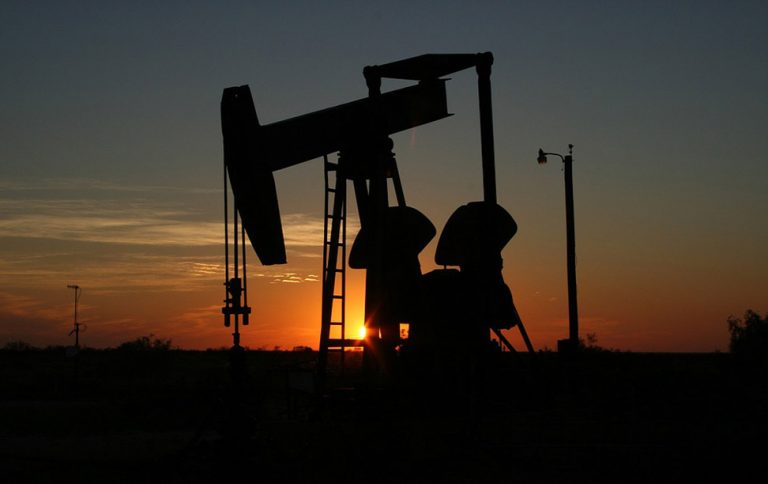 Oil holds sharp drop after US stockpiles expand to 10-month high