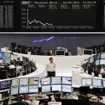 Asian markets mostly up as earnings distract from trade woes