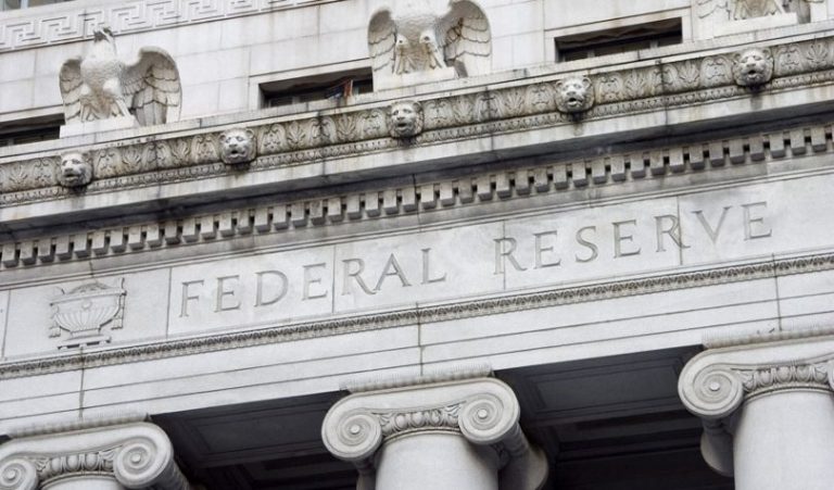 Federal Reserve holds steady, signals future cuts